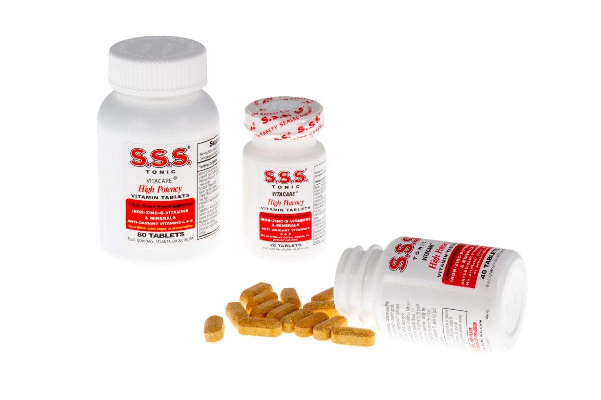 Two SSS Tablets bottles, one tipped over with tablets spilling out